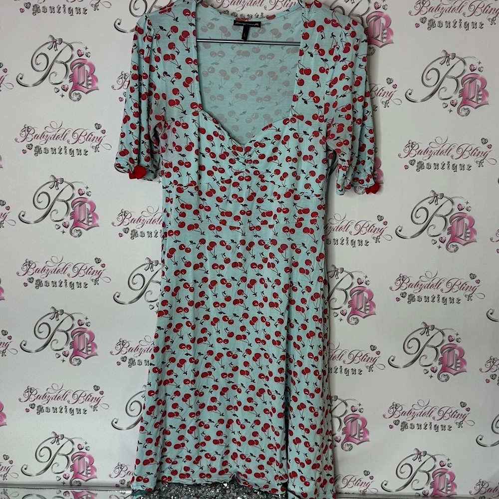 Sourpuss Cherry Print Dress in Light Blue and Red v neck stretchy bows sleeve